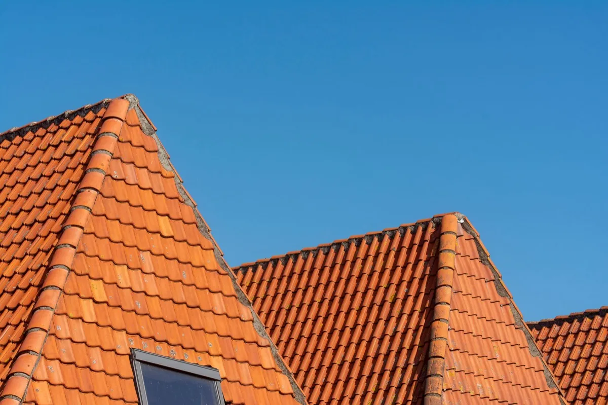 Clay barrel tile rooflines on homes in Terre Haute, IN